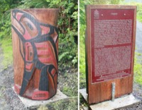 Vue avant et arrière d'un poteau en bois épais coupé en deux avec une sculpture d'un orque sur la courbe extérieure et une plaque sur la coupe plate. La plaque est en anglais et en français.
