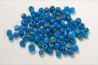 Blue glass beads with a hole through the middle for string.